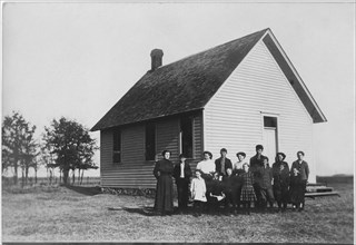 Teacher and Students in Front of One-Room School House, Portrait, USA, circa 1900