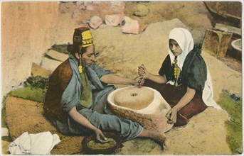 Two Women Grinding at a Mill, Jerusalem, Hand-Colored Postcard, 1914