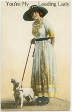Woman in Long Dress and Hat with Dog on Leash, "You're My Leading Lady", Postcard, circa 1910
