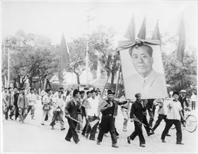 Demonstration Celebrating Great Proletarian Cultural Revolution with Portrait of Chairman Mao Zedong and Red Flags”, Documentary Film “Report From China", 1973