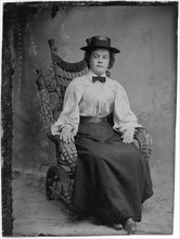 Portrait of Seated Adult Woman in Hat and Bow Tie, circa 1870