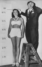 Mickey Rooney Measuring Height of Dorothy Ford, Promotional Portrait for the Film, "Uncle Andy Hardy", 1946