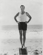 Actor George Bancroft, Portrait Standing on Wood Post at Beach, Santa Monica, California, USA, 1930's