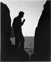 Richard Arlen, Silhouette Portrait Smoking Pipe at Beach, on-set of the Film, "Island of Lost Souls", 1932