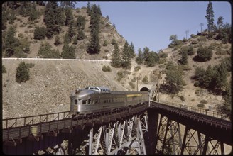 California Zephyr Train Exiting Tunnel on Elevated Track, California, USA, 1964