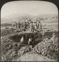 Burying the Russians killed in the desperate fighting on 203 Metre Hill in Besieged Port Arthur, Single Image of Stereo Card, Underwood & Underwood, 1905