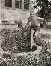 Charles Ruggles, Publicity Portrait Testing the Water of Aquarium at his Home, East Setauket, New York, USA, by Shalitt for Paramount Pictures, 1930's