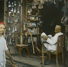 Shopkeeper, Kenya, Hand-Colored Magic Lantern Slide, Newton & Company, 1915