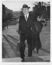 Earl Browder, former Communist Party General Secretary in the U.S., Arriving at U.S. District Court to Answer a Charge of Contempt of Congress for Refusal to Answer Questions of Investigating Committe...