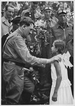 Adolf Hitler with Young Girl during one of his Electoral Campaigns, Germany, 1932
