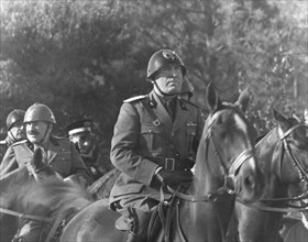 Benito Mussolini, on horseback, during Parade honoring Birthday of King Victor Emmanuel III, Rome, Italy, November 20, 1935