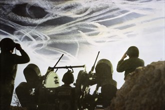 Crew of Multiple Gun Motor Carriage M16 Waiting to Fire on Enemy Plane as Vapor Trails Fill Sky, Ardennes-Alsace Campaign, Battle of the Bulge, 1944