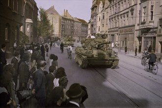 Civilians Watching U.S. Troops as they Advance Through Dusseldorf, Germany, Central Europe Campaign, Western Allied Invasion of Germany, 1945