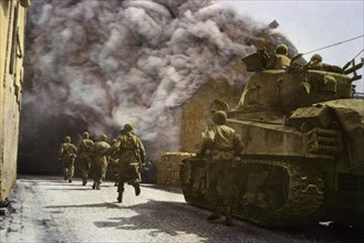 Men of Armored Division Running Through Smoke-Filled Street of German Town, Central Europe Campaign, Western Allied Invasion of Germany, 1945