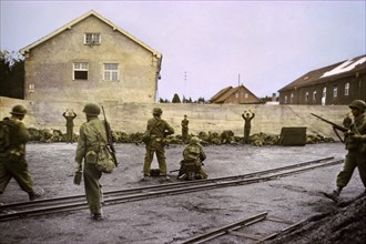 Capturing SS Guards in Coal Yard at Concentration Camp by 42nd Infantry Division, U.S. Seventh Army, Dachau, Germany, Central Europe Campaign, Western Allied Invasion of Germany, April 1945