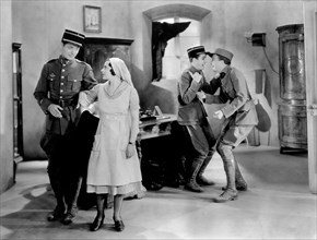 Robert Montgomery (left) with June Walker, on-set of the Film, "War Nurse", MGM, 1930