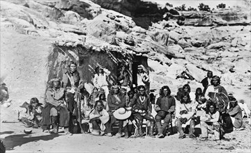 Paiute Indian Group in front of Adobe House, 1910