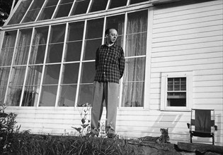 Composer Aaron Copland with his Pet Cat outside his House, Richmond, Massachusetts, USA, 1947
