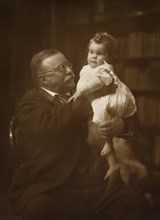 Theodore Roosevelt Holding infant Grandchild, July 8, 1918
