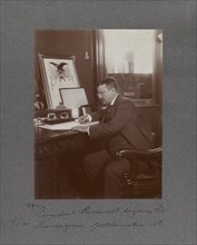 U.S. President Theodore Roosevelt, Seated Portrait at Desk Signing Thanksgiving Proclamation Act, Washington DC, USA, 1902