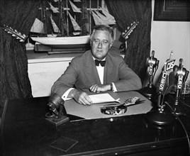 U.S. President Franklin Roosevelt Delivering Radio Speech at his Desk, White House, Washington DC, USA, Harris & Ewing, 1935