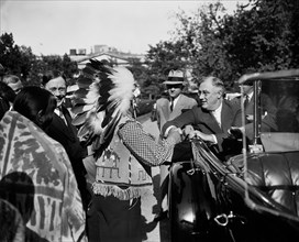 U.S. President Franklin Roosevelt Greeting Pueblo Indians while sitting in Convertible Car, Washington DC, USA, Harris & Ewing, 1936
