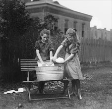 Two Girl Scouts Washing Clothes, Washington DC, USA, National Photo Company, 1920