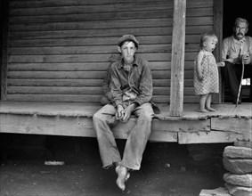 Young Sharecropper and Family on Rural Porch, Chesnee, South Carolina, USA, Dorothea Lange, Farm Security Administration, June 1937