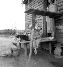 Young Child of Sharecropper on Rural Porch, Chesnee, South Carolina, USA, Dorothea Lange, Farm Security Administration, June 1937