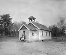 Teacher with Young Students Standing on Steps of One-Room Schoolhouse, South River Farm, Maryland, USA, National Photo Company, 1924