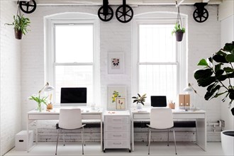 Monochromatic Modern Workplace with Floral Accents