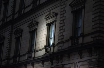 Spotlight on Exterior Window at Night