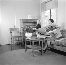 Two Women Relaxing in Livingroom, Interior of Completed House, New Deal Cooperative Community, Greenbelt, Maryland, USA, Arthur Rothstein, Farm Security Administration, November 1936