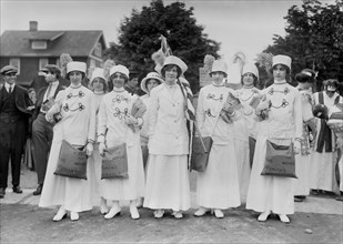Elisabeth Freeman (center holding American flag) with Suffrage News Girls, Bains News Service, May 1913