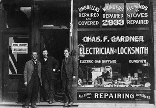 Three men Standing at Entrance African American Business Establishment of "Chas. F. Gardner Electrician and Locksmith "Chicago, Illinois, USA, W.E.B. DuBois Collection, 1899