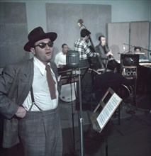 Portrait of Frankie Laine (foreground) and Jimmy Crawford (background on drums), New York City, New York, USA, William P. Gottlieb Collection, 1948