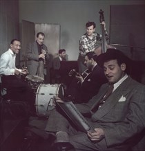 Portrait of Frankie Laine (foreground) and Jimmy Crawford (left on drums), New York City, New York, USA, William P. Gottlieb Collection, 1948