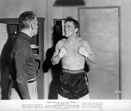 Actor Kirk Douglas (right), on-set of the Film, "Champion", United Artists, 1949