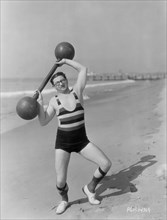 Actor Harry Green, Publicity Portrait Lifting Barbell on Beach, early 1930's