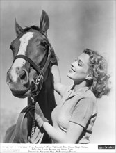 Actress Ellen Drew, Publicity Portrait with Horse for the film, "The Lady's from Kentucky", Paramount Pictures, 1939