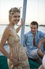 Young Couple Relaxing on Sailboat