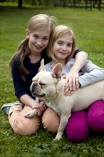 Two Smiling Girls With Dog