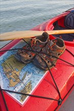 Water Shoes and Map Strapped to Kayak, Close-Up