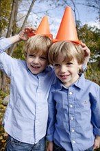 Two Boys With Cones on Heads