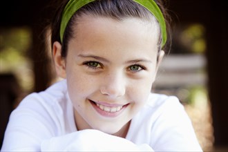 Smiling Girl With Green Headband, Close Up