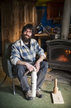 Portrait of Woodworker Sitting in Chair