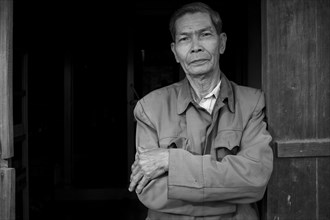 Elderly Vietnamese Man Standing in Doorway, Portrait