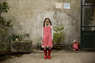 Young Vietnamese Girl in Yard, Portrait
