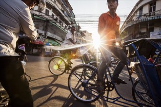 Cyclo Drivers on Busy Street, Phnom Penh, Cambodia