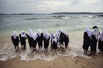 Young Muslim Students at Edge of Beach, Rear View, Salle, Sri Lanka
